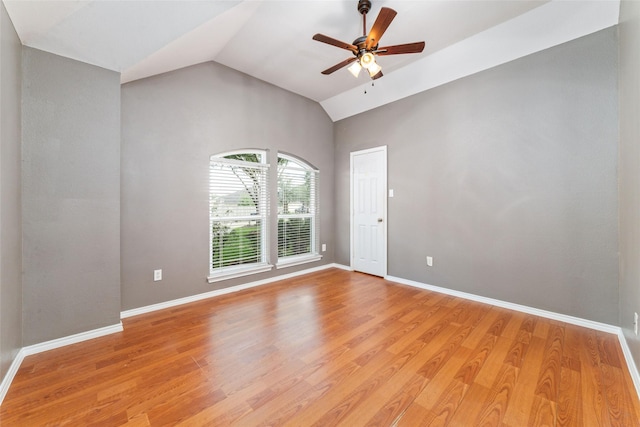 unfurnished room with lofted ceiling, light hardwood / wood-style flooring, and ceiling fan