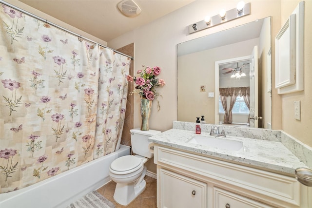 full bathroom featuring tile patterned flooring, vanity, shower / bath combo with shower curtain, and toilet