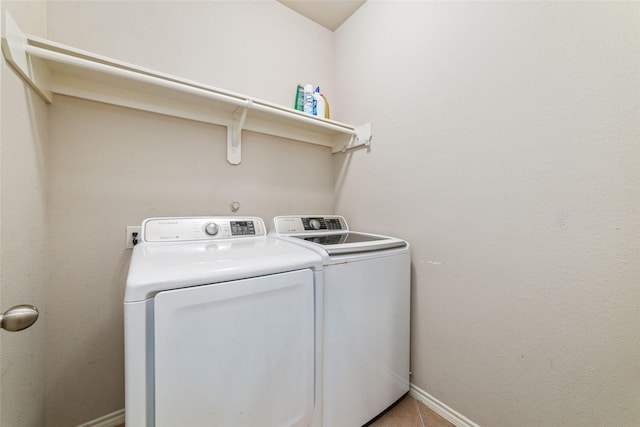 washroom with washer and dryer