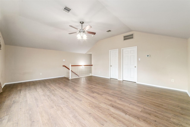 interior space with wood-type flooring, vaulted ceiling, and ceiling fan