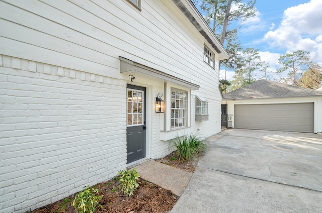 doorway to property featuring a garage