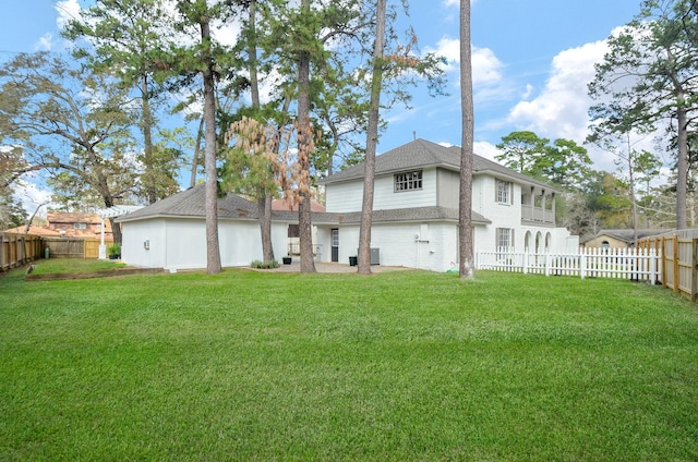 back of house with a yard