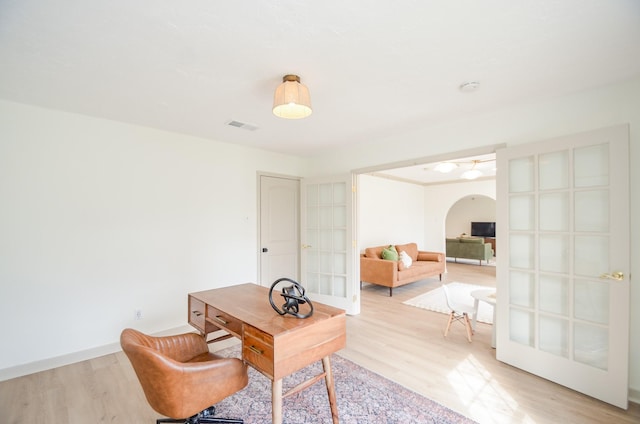 office space featuring light hardwood / wood-style flooring and french doors