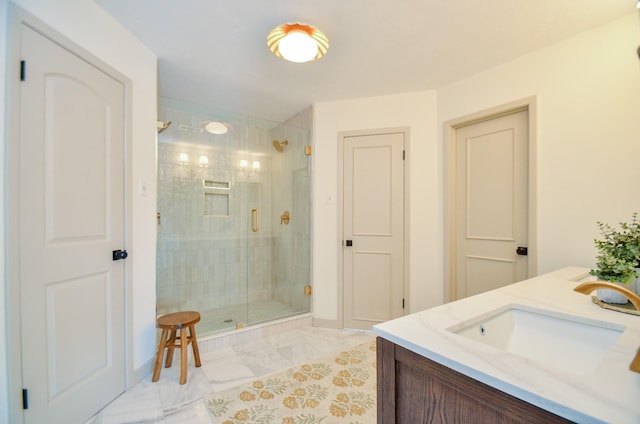 bathroom featuring vanity and an enclosed shower