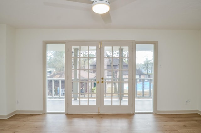 entryway featuring french doors and light hardwood / wood-style flooring