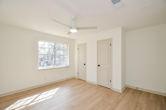 unfurnished bedroom featuring ceiling fan and light hardwood / wood-style floors