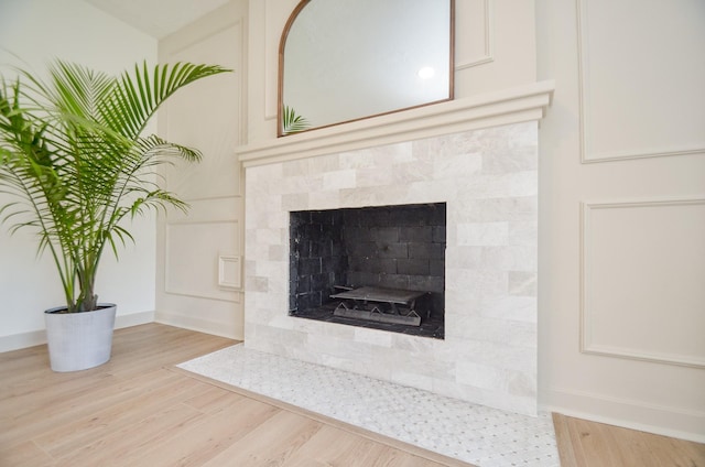 interior details featuring a fireplace and hardwood / wood-style floors