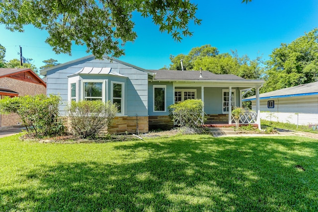 view of front of home featuring a front yard and a porch