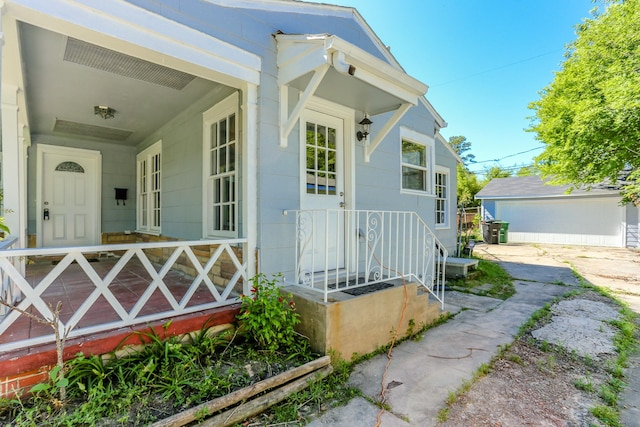 view of front of property with an outbuilding and a garage