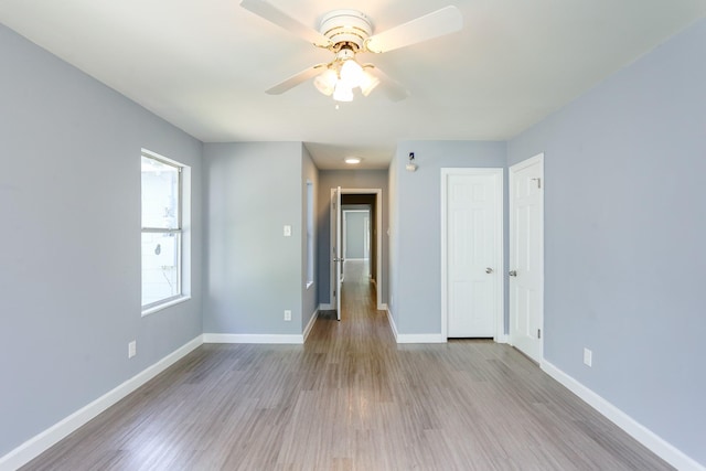 empty room featuring light hardwood / wood-style floors and ceiling fan