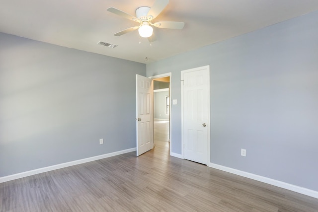 unfurnished bedroom featuring ceiling fan and light wood-type flooring