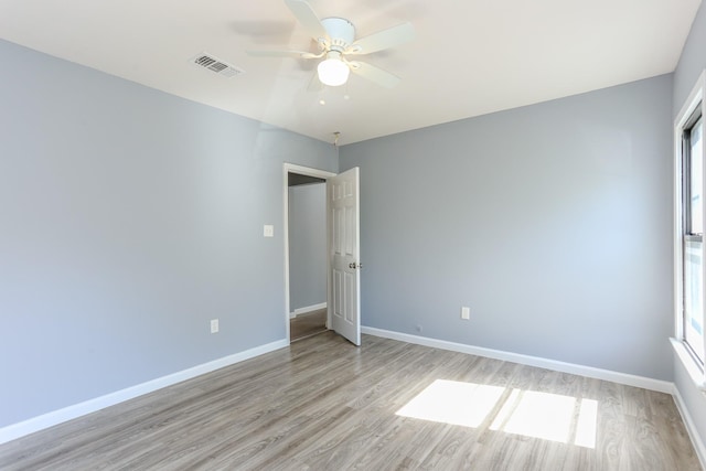 spare room with ceiling fan and light hardwood / wood-style flooring