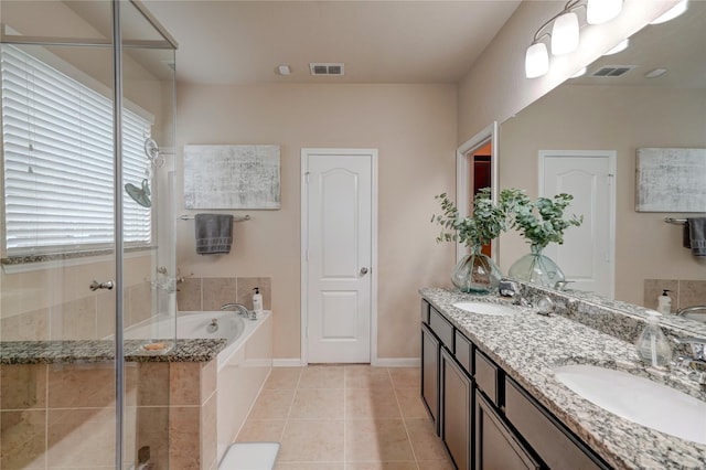 bathroom featuring tile patterned flooring, vanity, and independent shower and bath