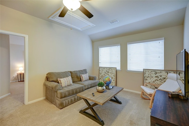 living room featuring ceiling fan, vaulted ceiling, and carpet