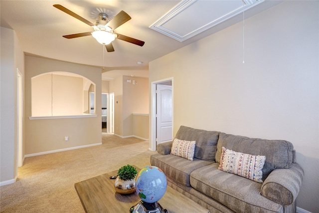 living room featuring light colored carpet and ceiling fan