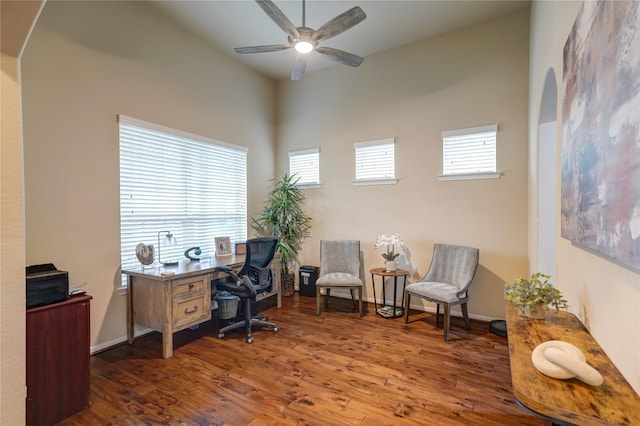 office space with ceiling fan, dark hardwood / wood-style flooring, and a wealth of natural light