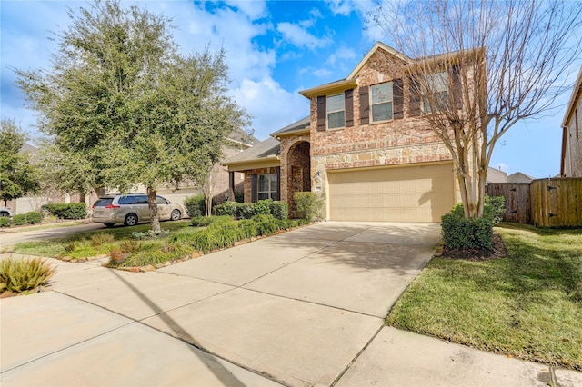 view of front of home featuring a garage and a front yard