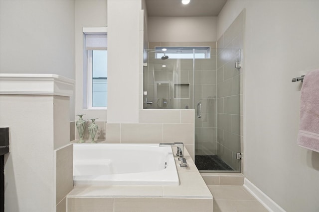 bathroom with tile patterned floors and plus walk in shower