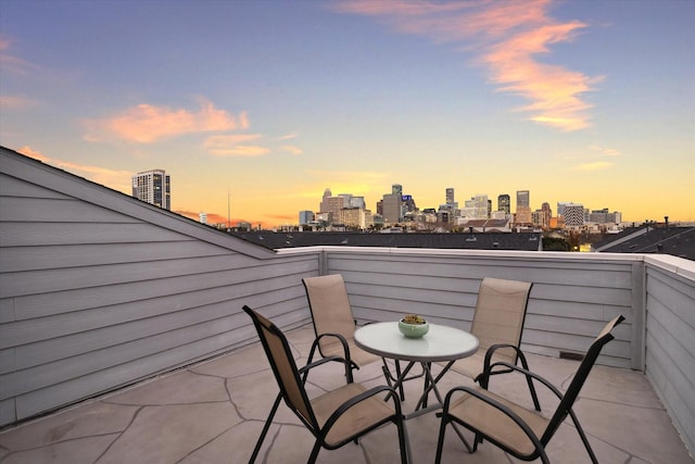 patio terrace at dusk with a balcony