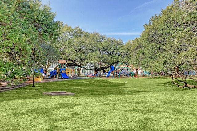 view of community featuring a yard and a playground