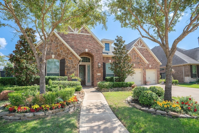 view of front of house with a garage and a front yard