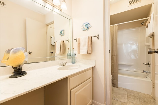 bathroom featuring shower / bath combo and vanity