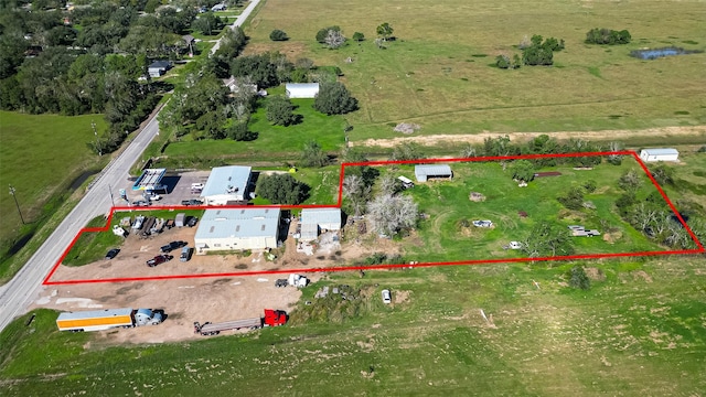 birds eye view of property featuring a rural view