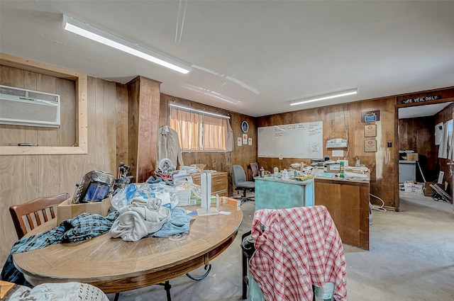 dining area with a wall mounted air conditioner and wooden walls