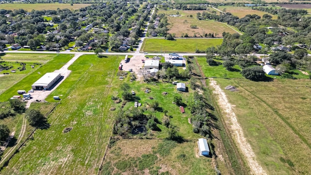 birds eye view of property with a rural view
