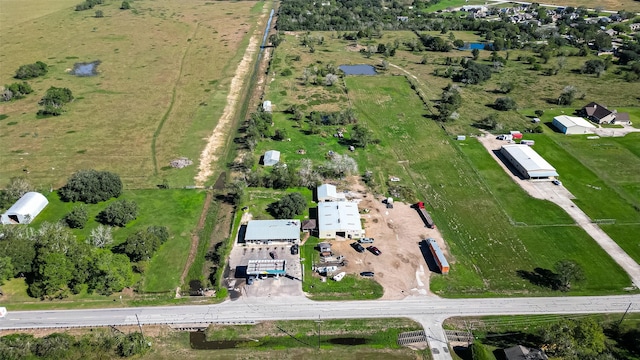 birds eye view of property featuring a rural view