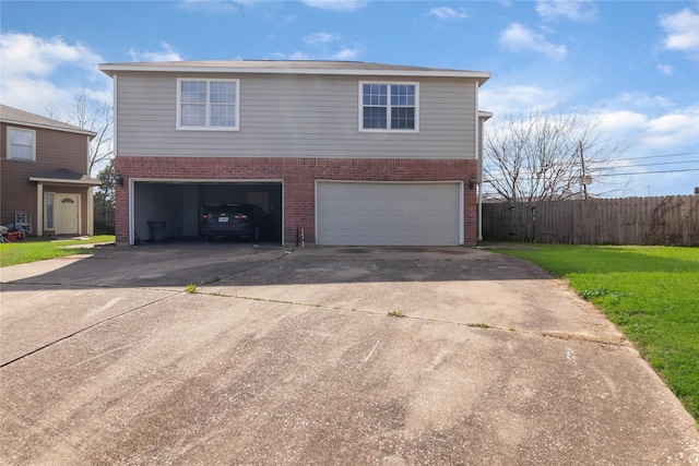 view of front facade with a garage and a front lawn