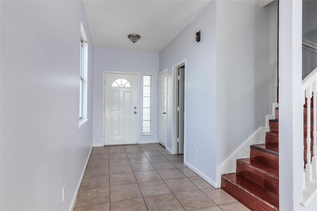 entryway featuring light tile patterned floors