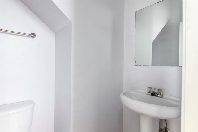 bathroom with sink and toilet