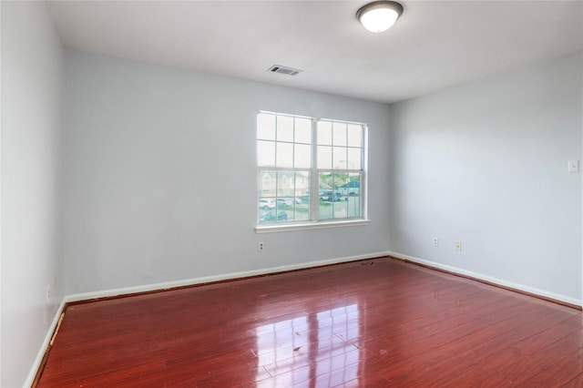 unfurnished room featuring wood-type flooring