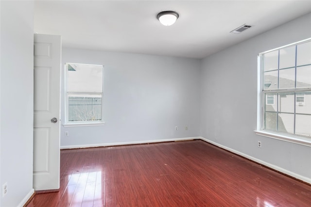 empty room with wood-type flooring