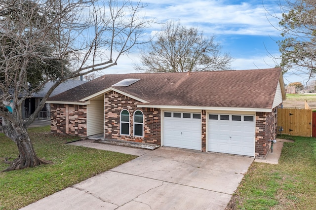 ranch-style home with a garage and a front yard