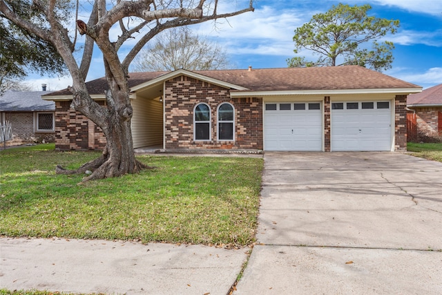 4706 Jefferson St, Deer Park, TX 77536 - ranch-style house with roof with shingles, a front lawn, driveway, brick siding, and a garage