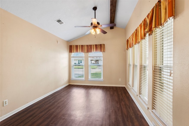 unfurnished room featuring ceiling fan, dark hardwood / wood-style floors, and vaulted ceiling with beams