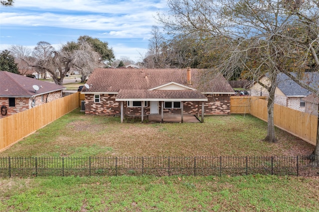 back of property featuring a patio area and a lawn