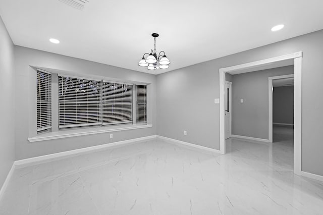 unfurnished dining area with a chandelier