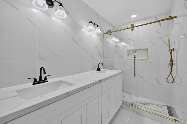 bathroom featuring vanity, tile walls, and walk in shower