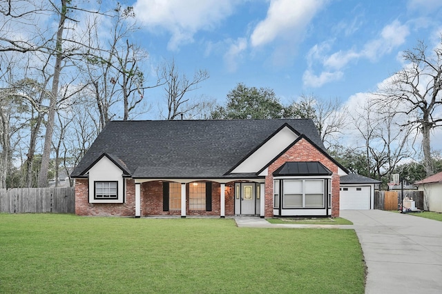 view of front facade with a garage and a front lawn