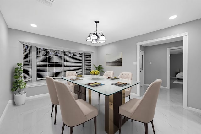 dining room featuring a notable chandelier