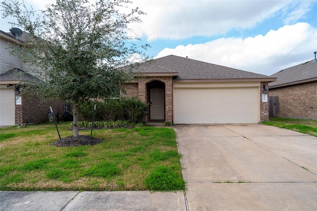 view of front of home featuring a garage and a front lawn