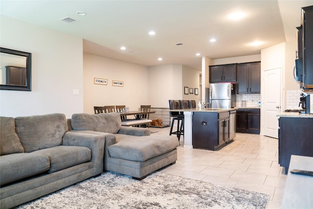 living room with light tile patterned floors