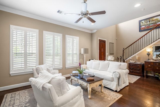 living room with ornamental molding, ceiling fan, and dark hardwood / wood-style flooring