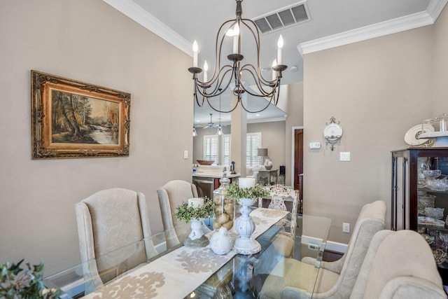 dining area featuring a notable chandelier and ornamental molding