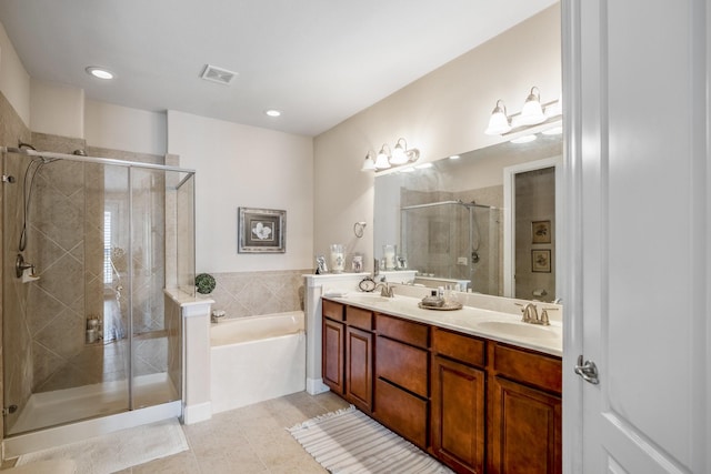 bathroom with tile patterned flooring, vanity, and independent shower and bath