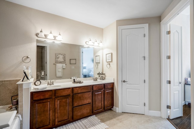 bathroom with vanity and tile patterned flooring