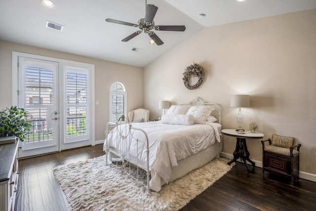 bedroom featuring dark hardwood / wood-style flooring, access to exterior, lofted ceiling, and ceiling fan